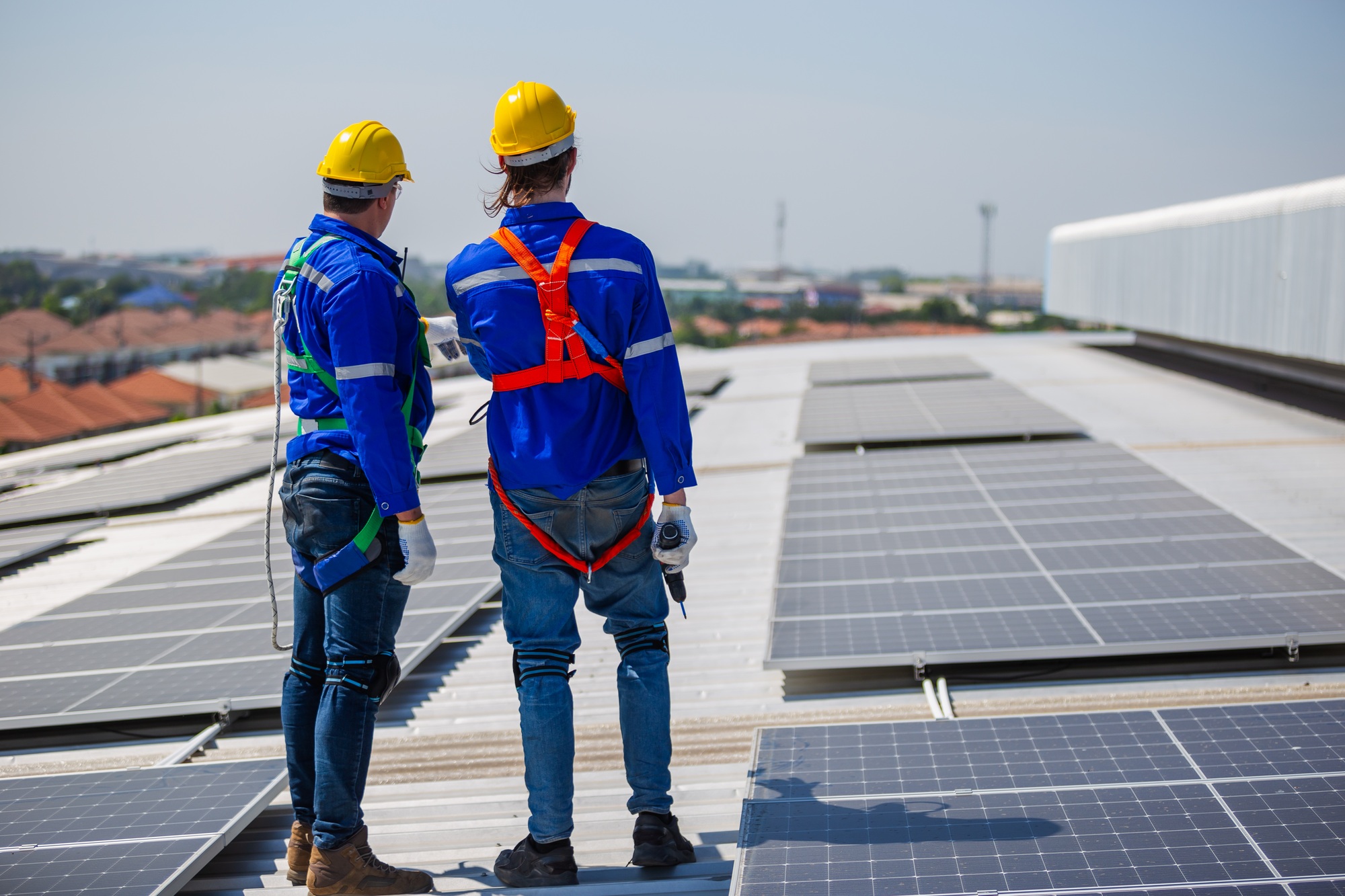 technicians-are-inspecting-standards-of-solar-panels-on-roof-of-an-industrial-factory.jpg